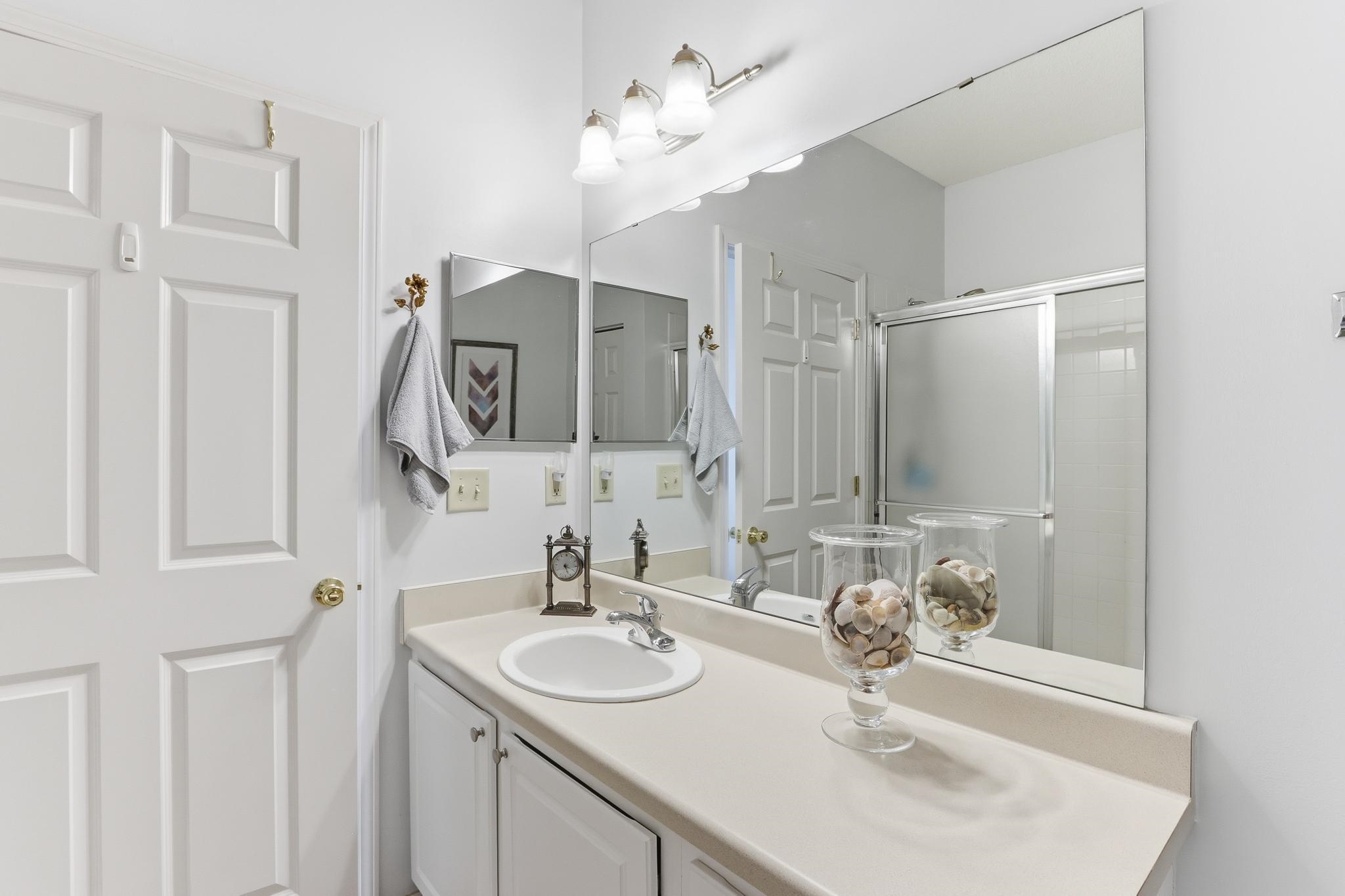1075 Oak Timber Circle, Unit 69 Collierville, TN 38017 - Photo 29 of 35 a bathroom with a sink and a mirror