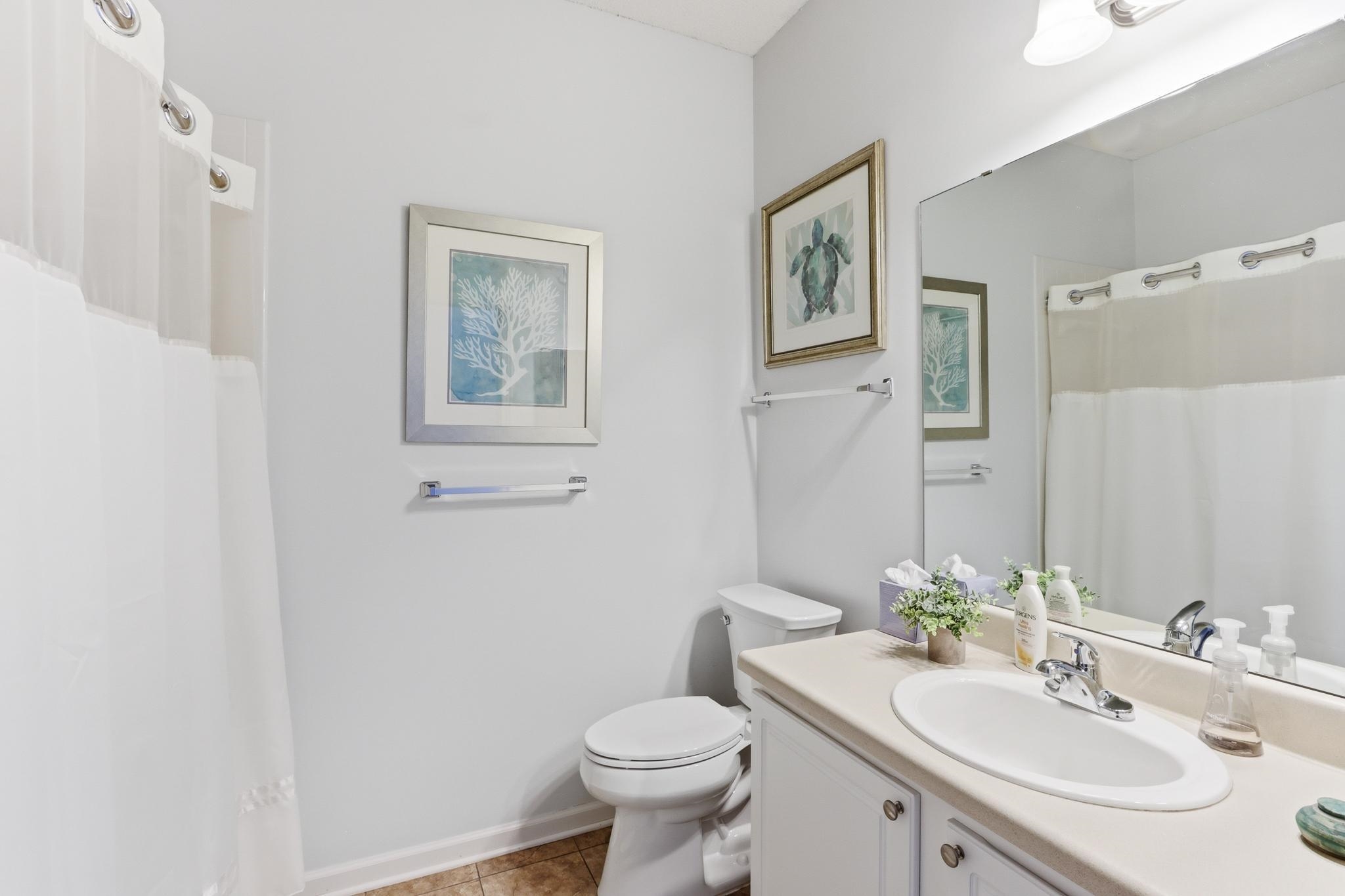 1075 Oak Timber Circle, Unit 69 Collierville, TN 38017 - Photo 31 of 35 a bathroom with a toilet sink and mirror