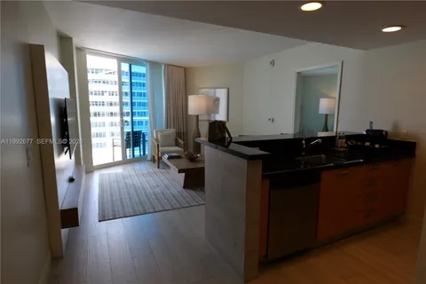 a kitchen with sink and cabinets