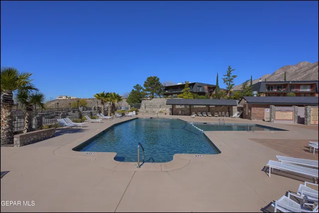 a view of a swimming pool with a patio