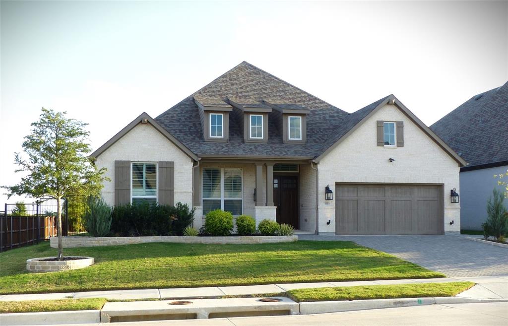a view of a yard in front view of a house