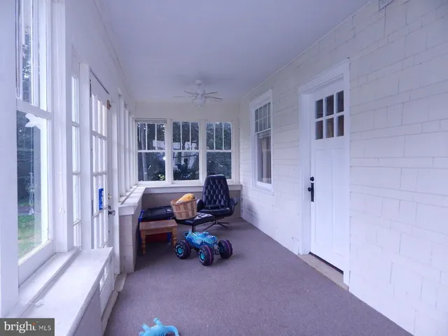 a view of livingroom with furniture and staircase