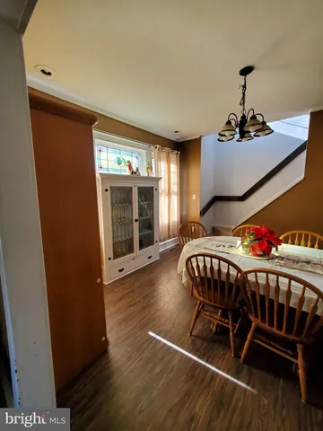 a bedroom with furniture and wooden floor