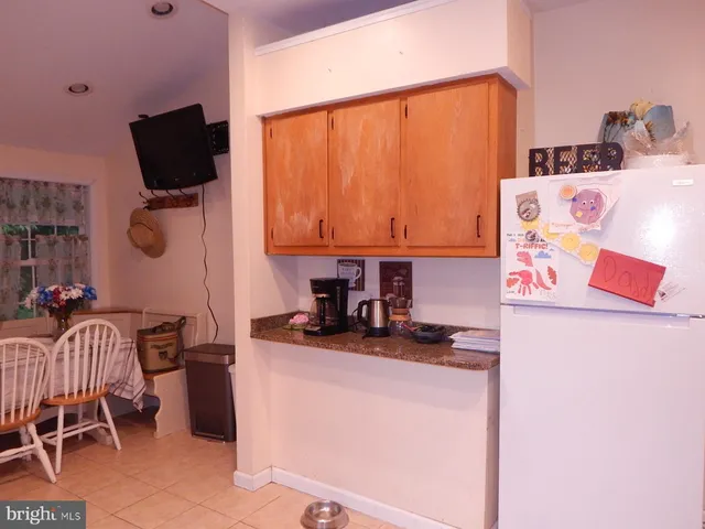 a kitchen with a sink a stove and a microwave