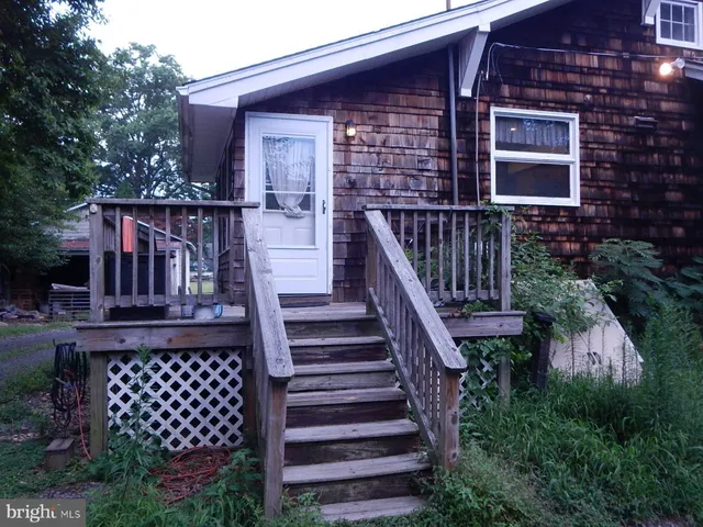 front view of a house with wooden stairs