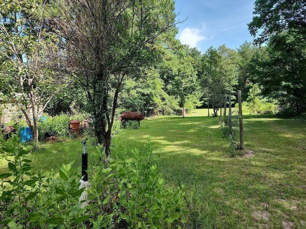 479 Upper Leggett Road Livingston, TX 77351 - Photo 2 of 6 a large green field with lots of trees