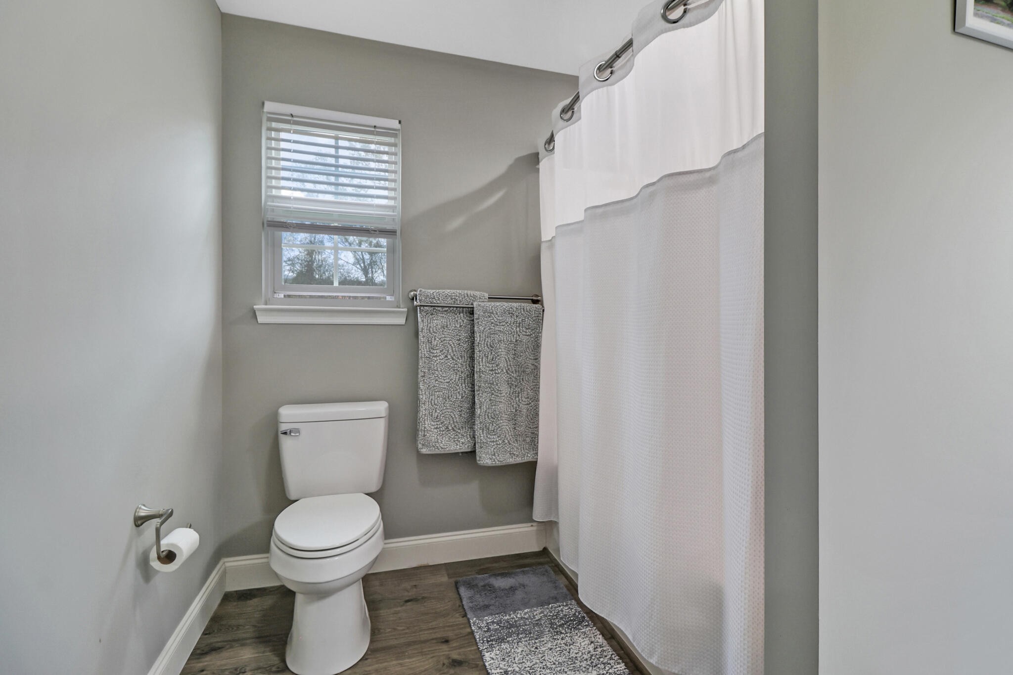 1095 Fugate Road Evensville, TN 37332 - Photo 12 of 50 a white toilet sitting next to a window