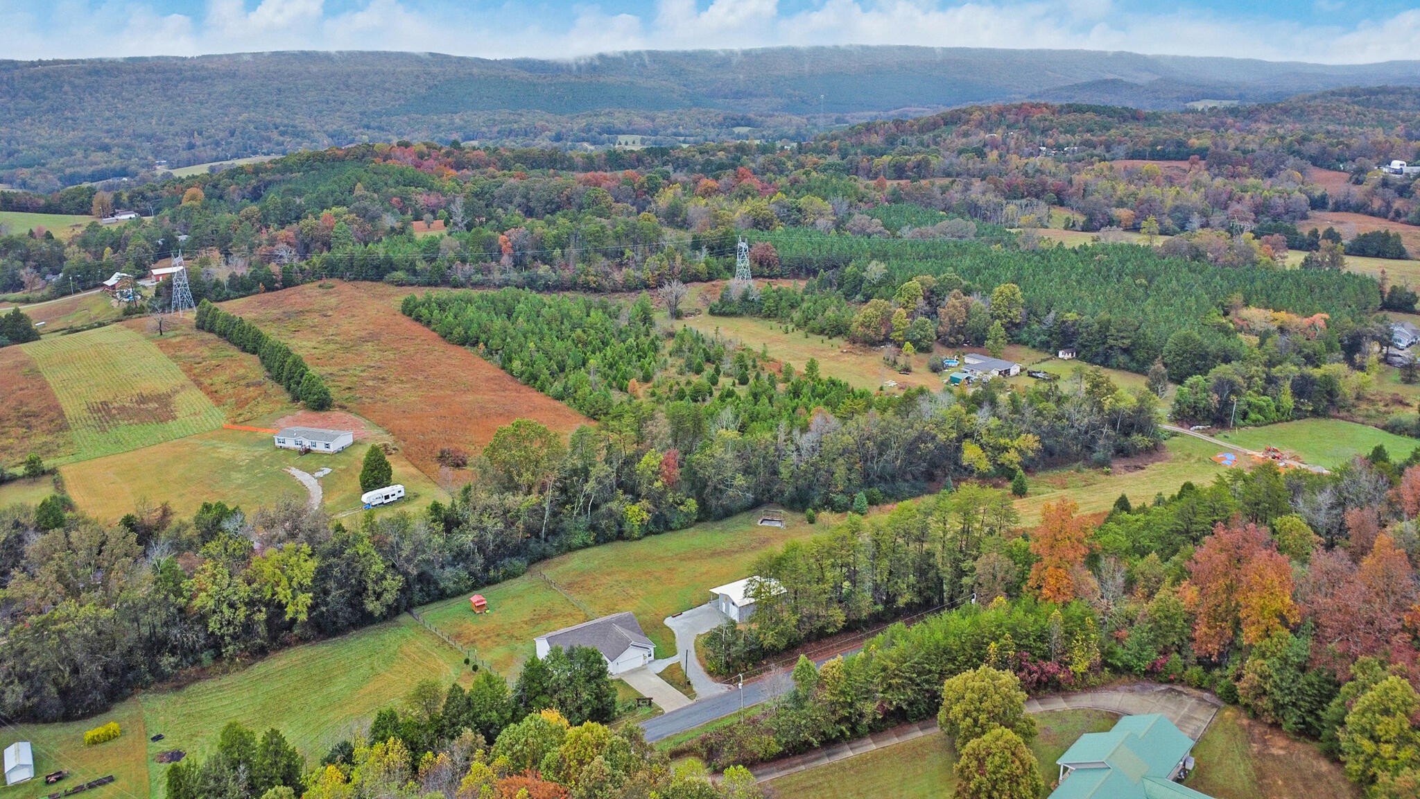 1095 Fugate Road Evensville, TN 37332 - Photo 26 of 50 an aerial view of residential houses with outdoor space and river