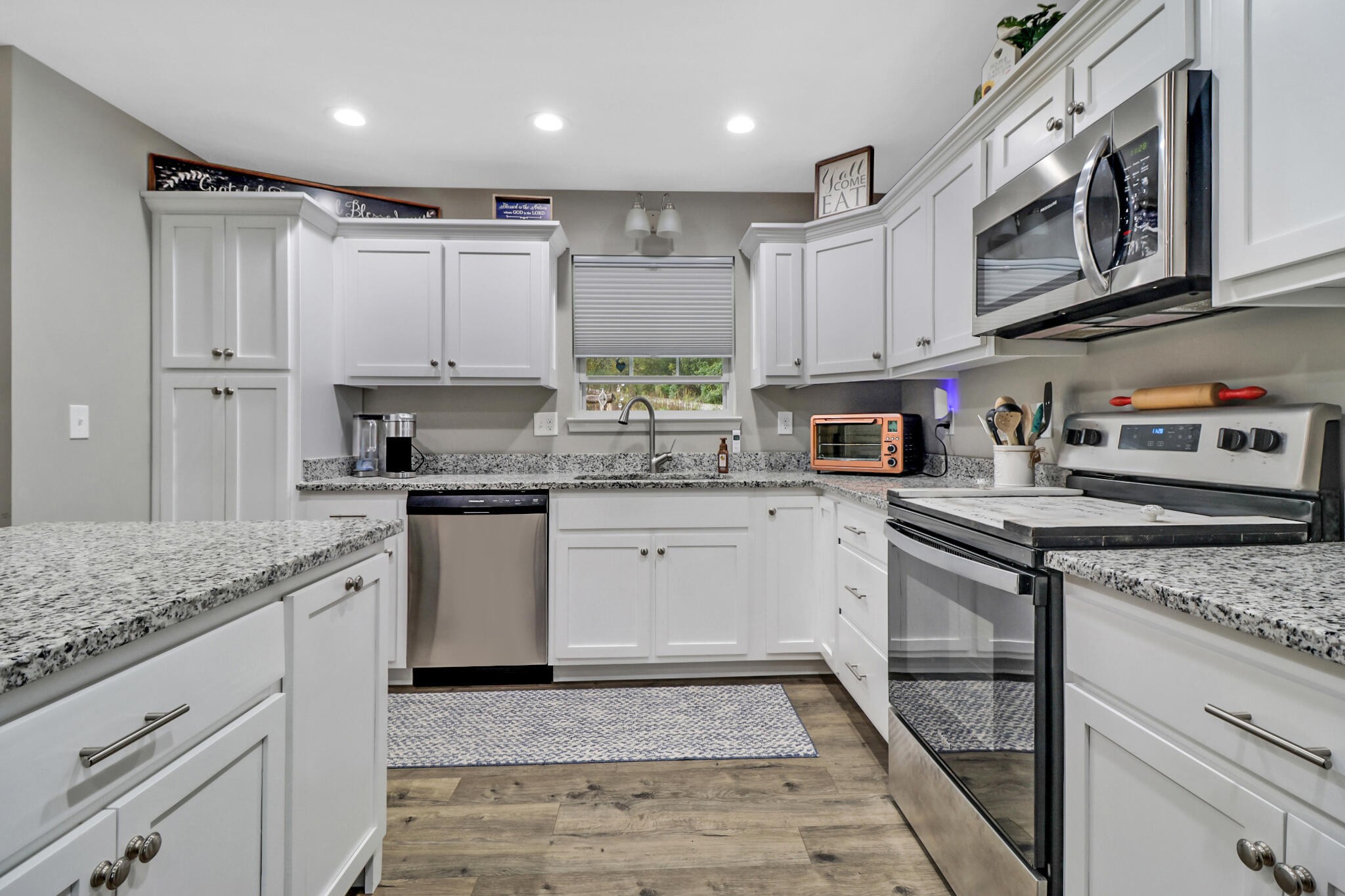 1095 Fugate Road Evensville, TN 37332 - Photo 7 of 50 a kitchen with stainless steel appliances granite countertop a sink a stove and cabinets