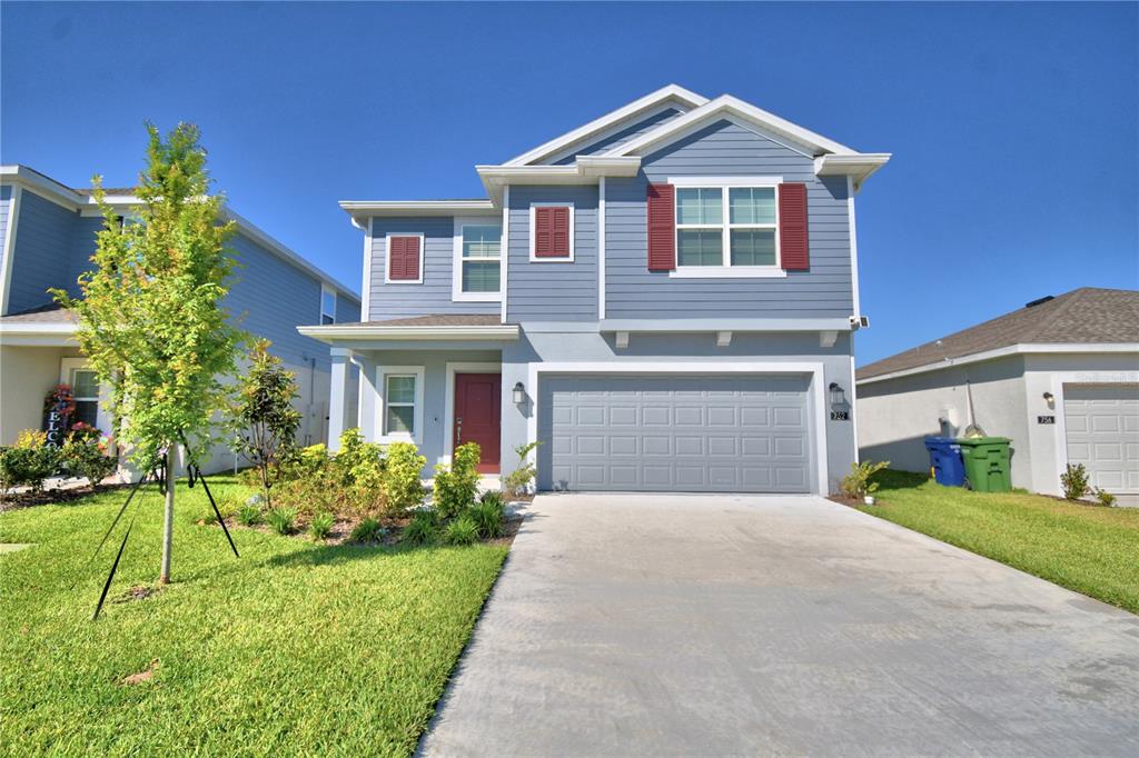 752 Reggie Road Winter Haven, FL 33859 - Photo 1 of 1 a front view of a house with a yard and garage