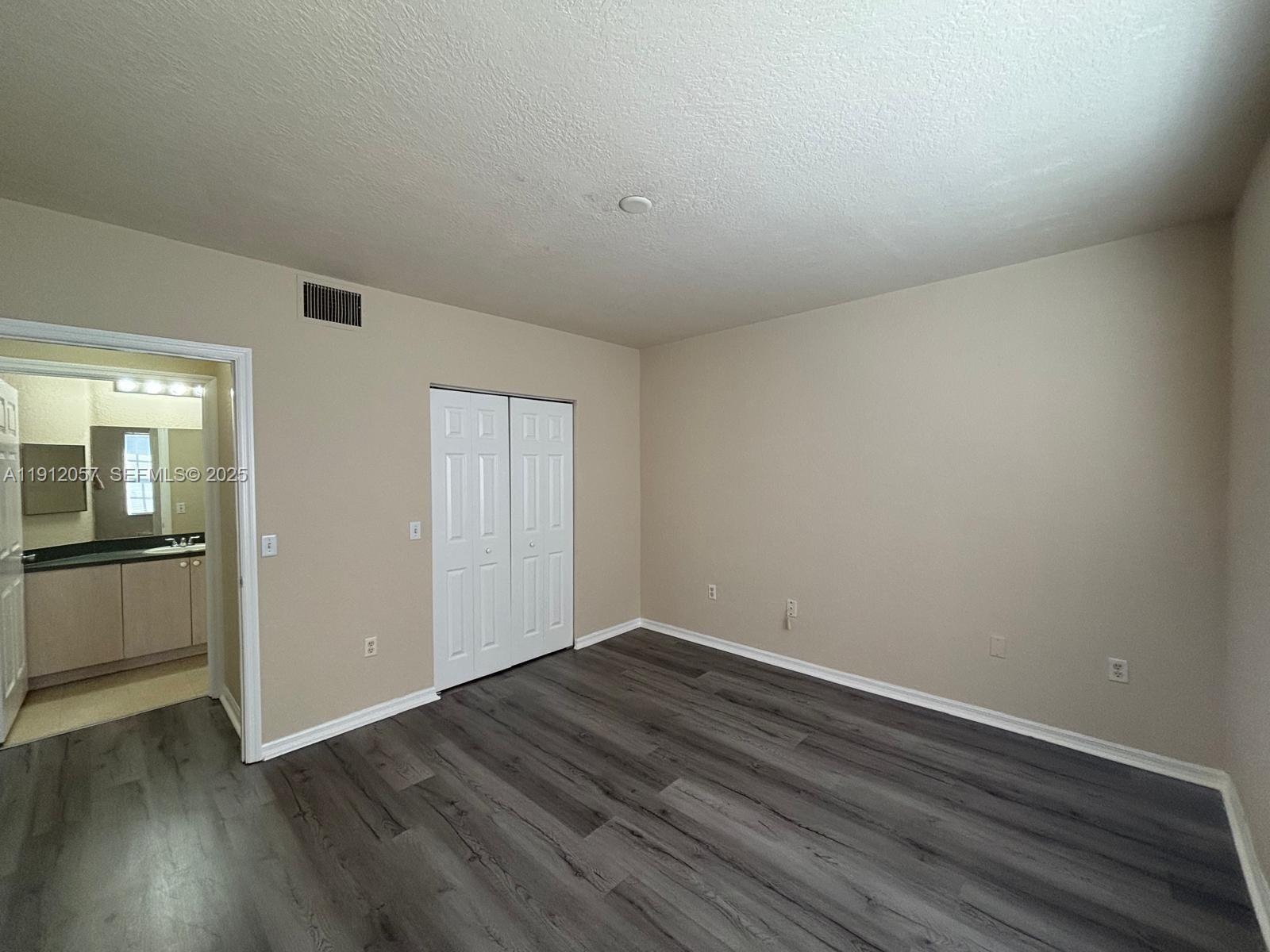 8261 Southwest 25th Court, Unit 102 Miramar, FL 33025 - Photo 11 of 15 a view of a room with wooden floor