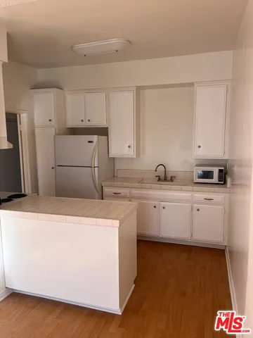 a kitchen with cabinets and sink