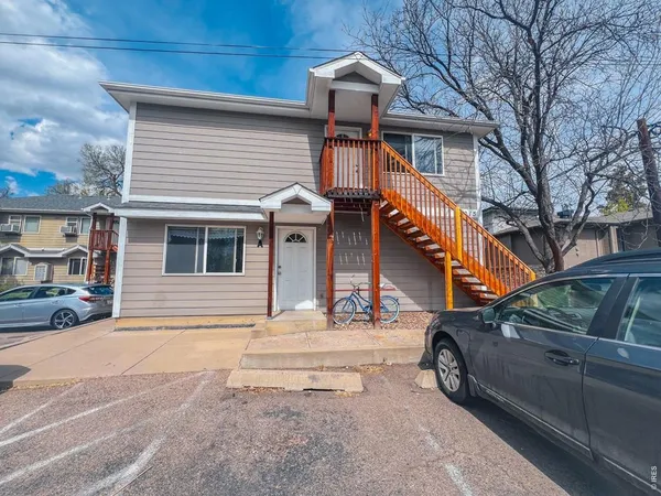 a view of a car park in front of house