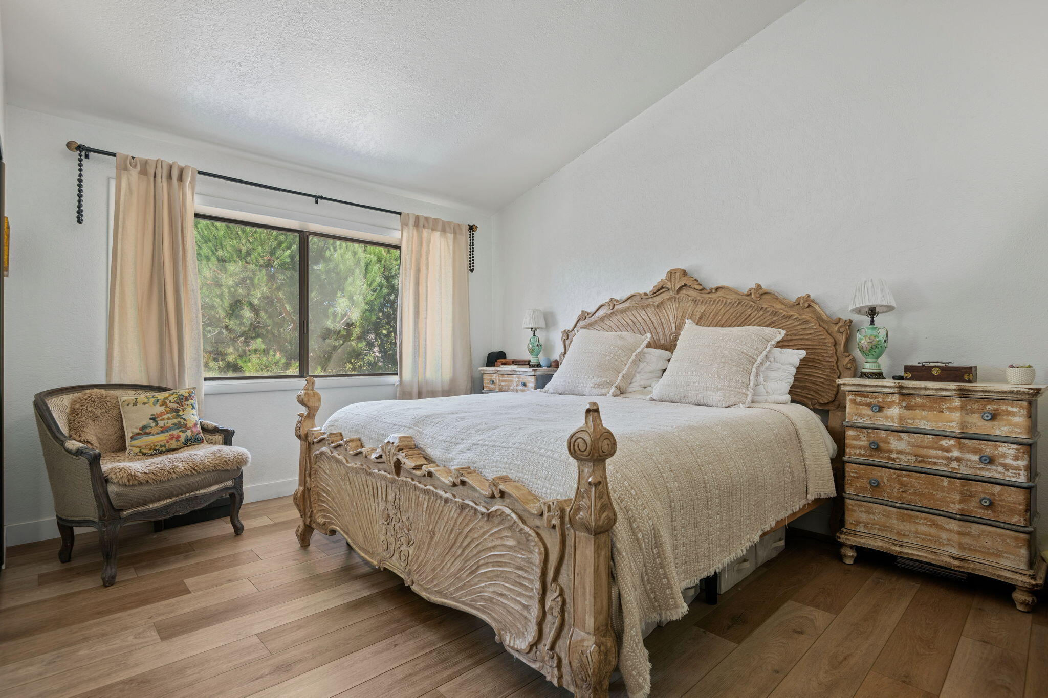 2455 Lucca Avenue Los Olivos, CA 93441 - Photo 11 of 37 a bedroom with a bed and a couch with wooden floor