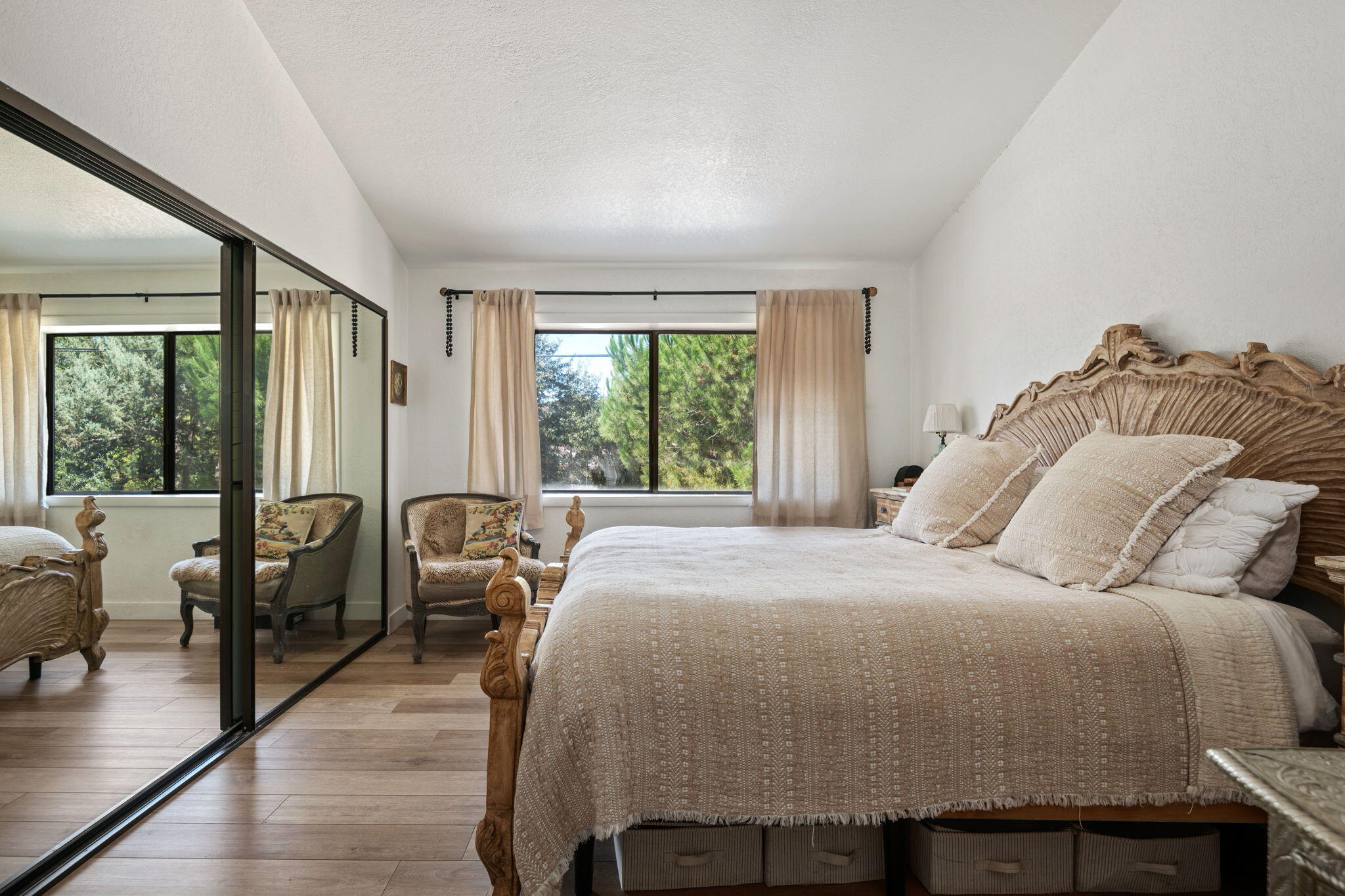 2455 Lucca Avenue Los Olivos, CA 93441 - Photo 12 of 37 a bed sitting in a bedroom next to a window with balcony