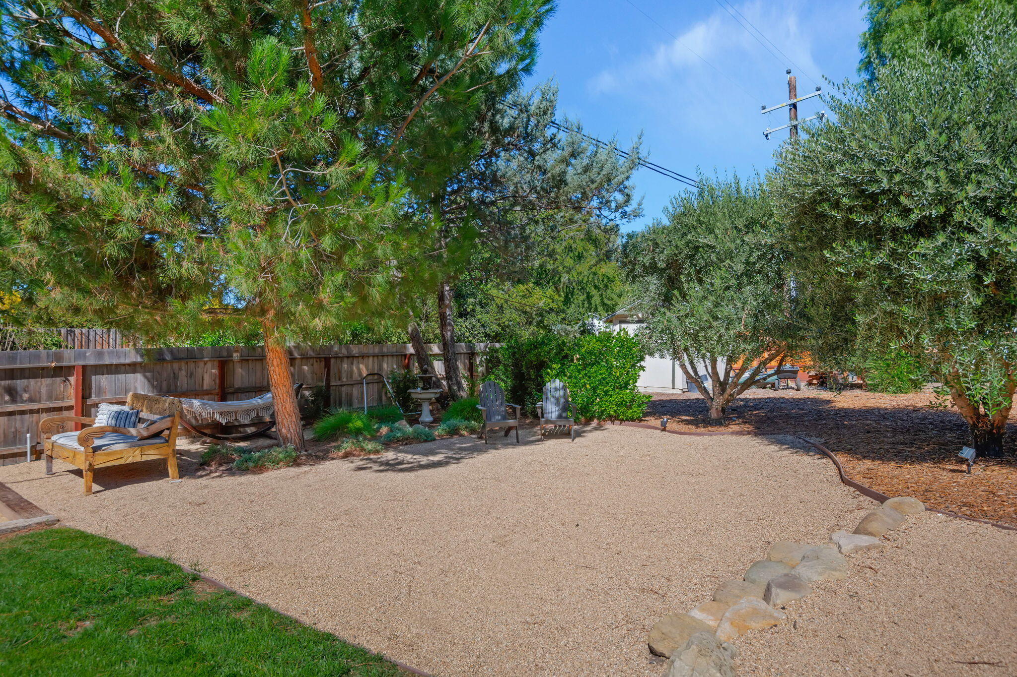 2455 Lucca Avenue Los Olivos, CA 93441 - Photo 24 of 37 a row of palm trees in the middle of a garden