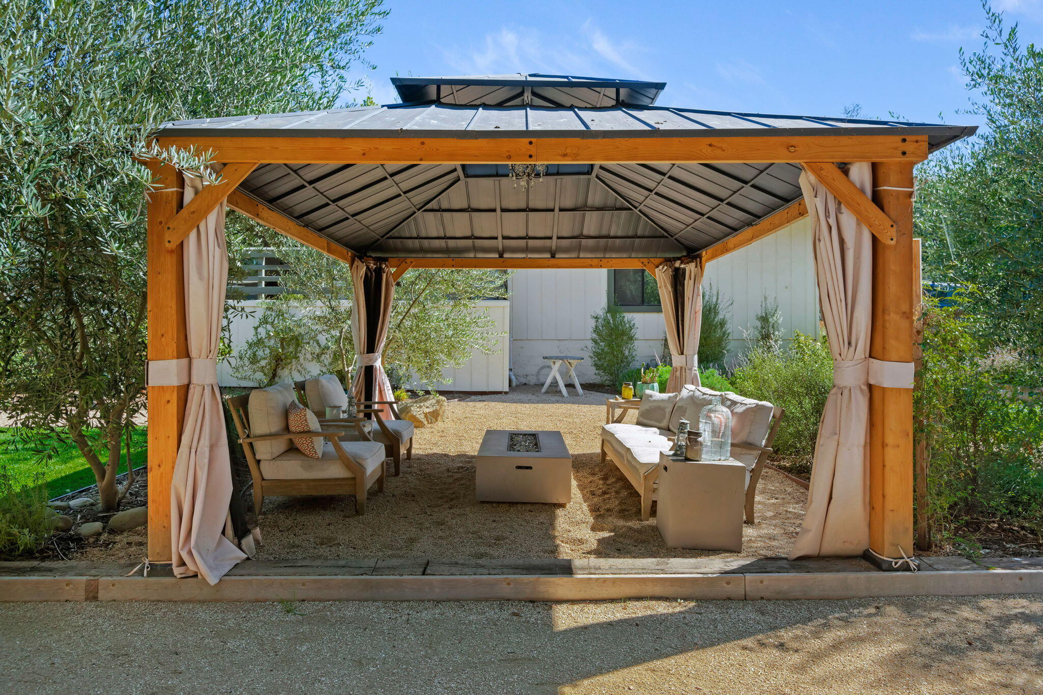2455 Lucca Avenue Los Olivos, CA 93441 - Photo 27 of 37 a view of patio with lawn chairs under an umbrella