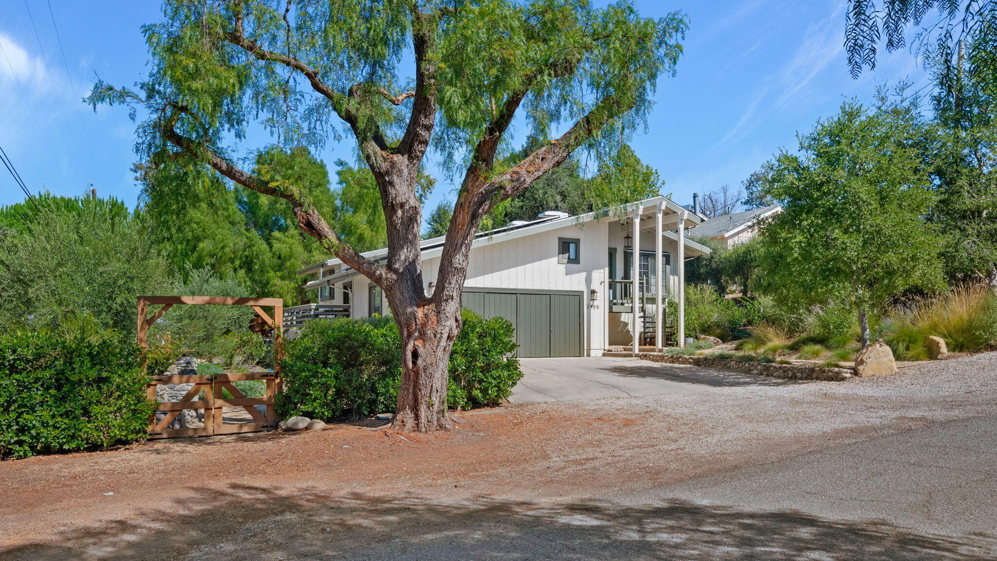 2455 Lucca Avenue Los Olivos, CA 93441 - Photo 32 of 37 a view of a house with a tree and plants