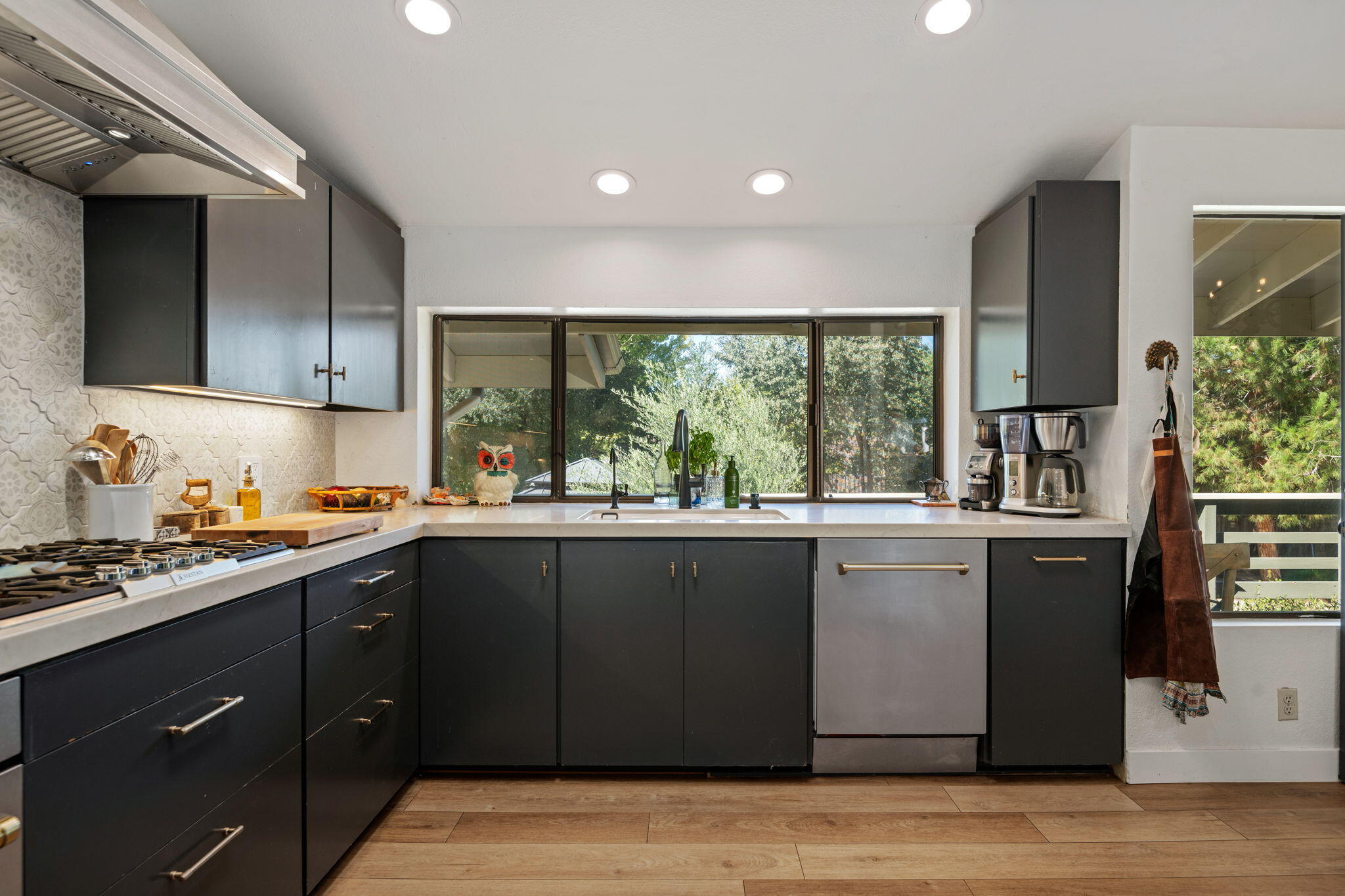 2455 Lucca Avenue Los Olivos, CA 93441 - Photo 4 of 37 a kitchen with a sink stove and cabinets
