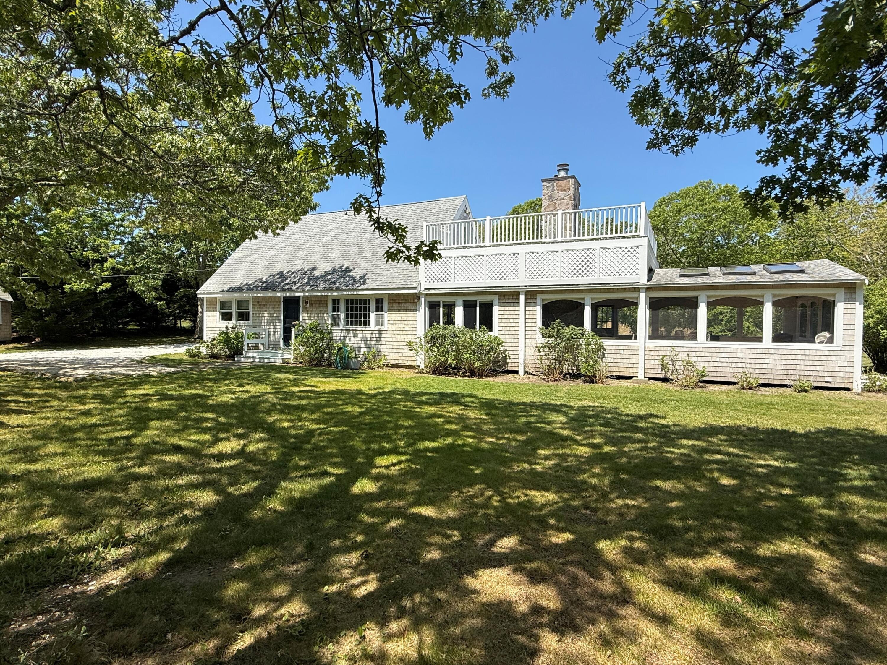 5 Pip'n Road Edgartown, MA 02539 - Photo 3 of 25 a front view of a house with a garden