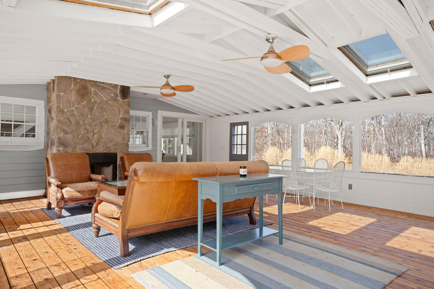 5 Pip'n Road Edgartown, MA 02539 - Photo 8 of 25 a living room with patio furniture and a fireplace