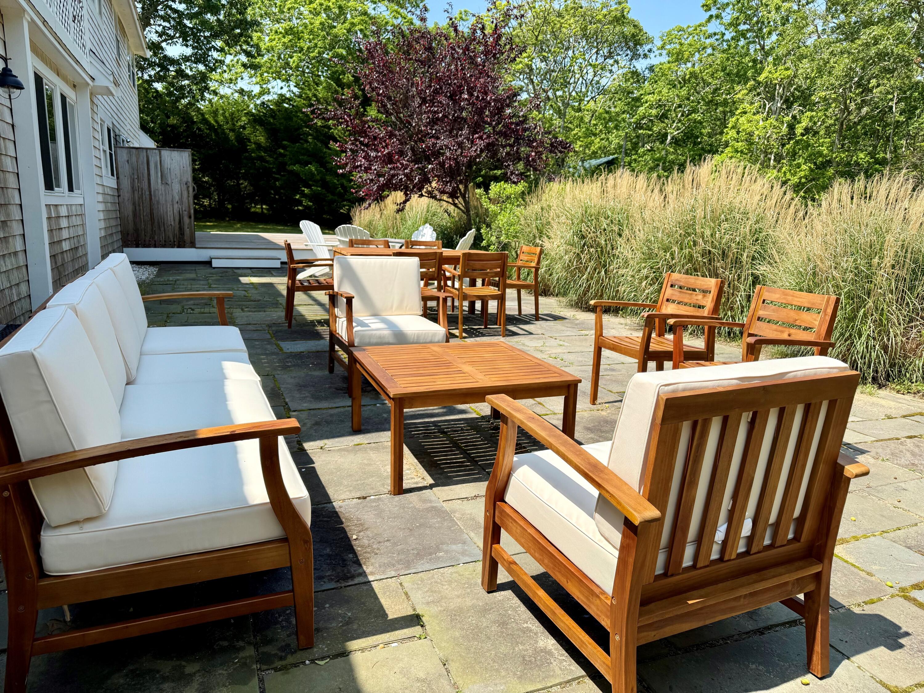 5 Pip'n Road Edgartown, MA 02539 - Photo 9 of 25 an outdoor sitting area with furniture and a yard