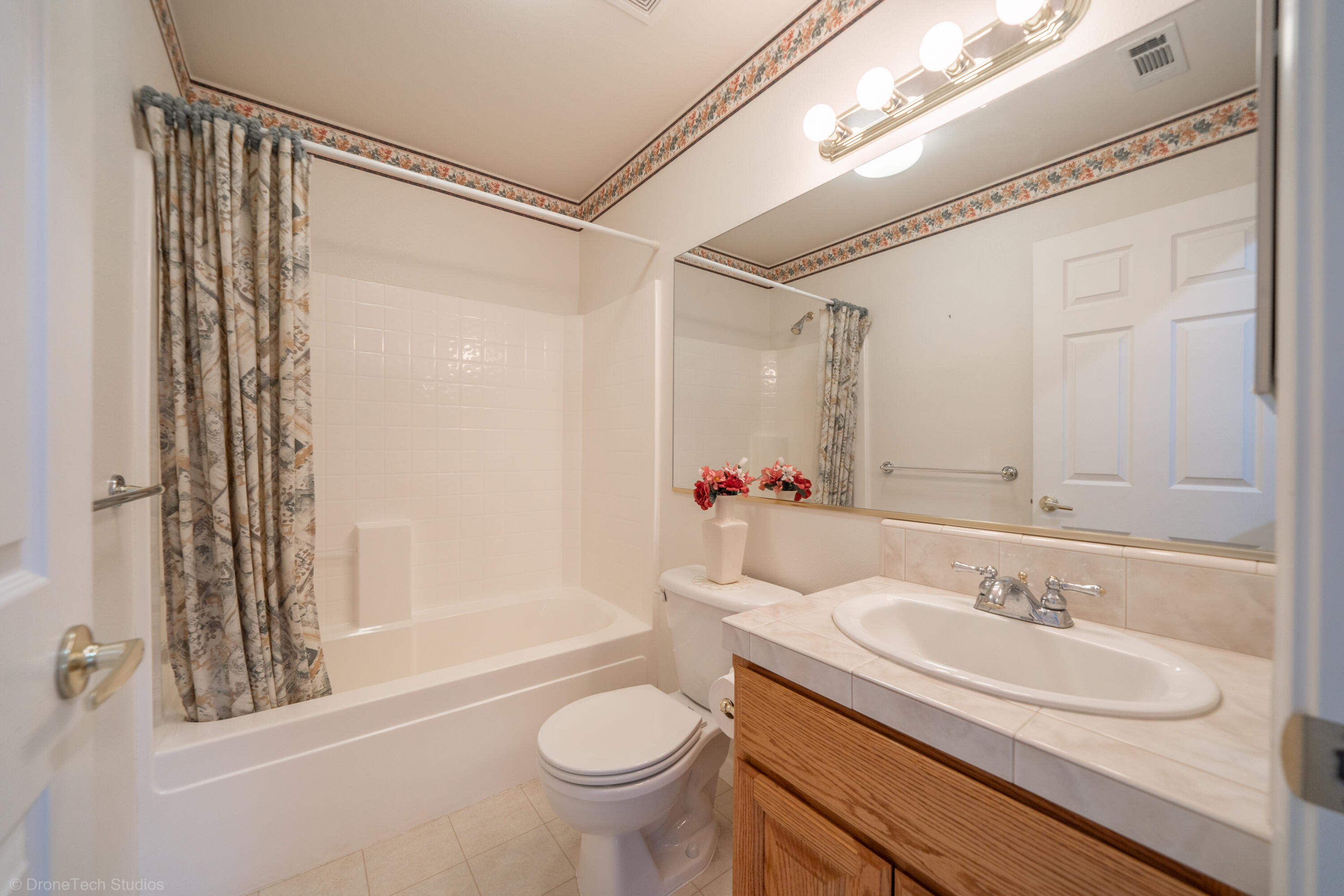 662 Volcano View Trail Redding, CA 96003 - Photo 15 of 26 a bathroom with a sink and a mirror