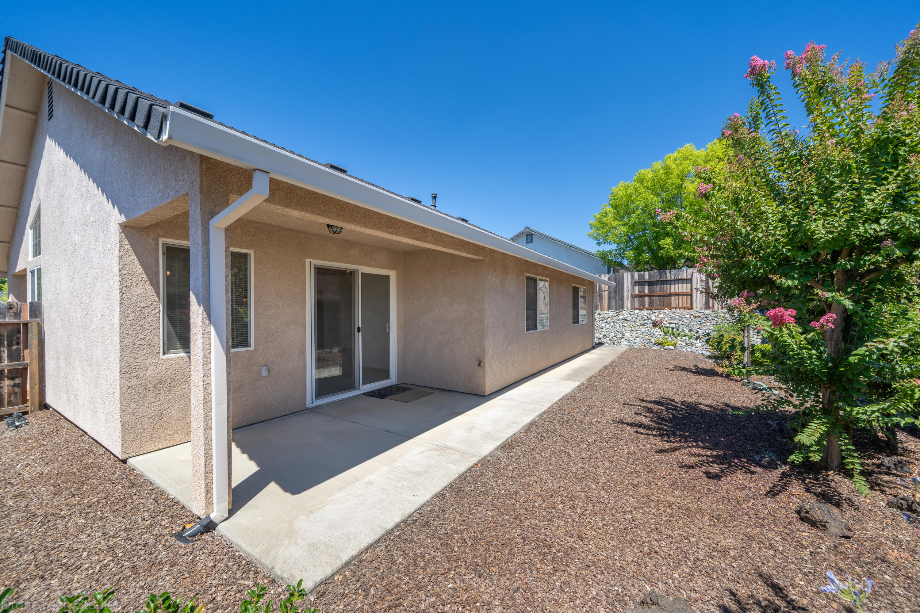 662 Volcano View Trail Redding, CA 96003 - Photo 18 of 26 a view of a house with a backyard