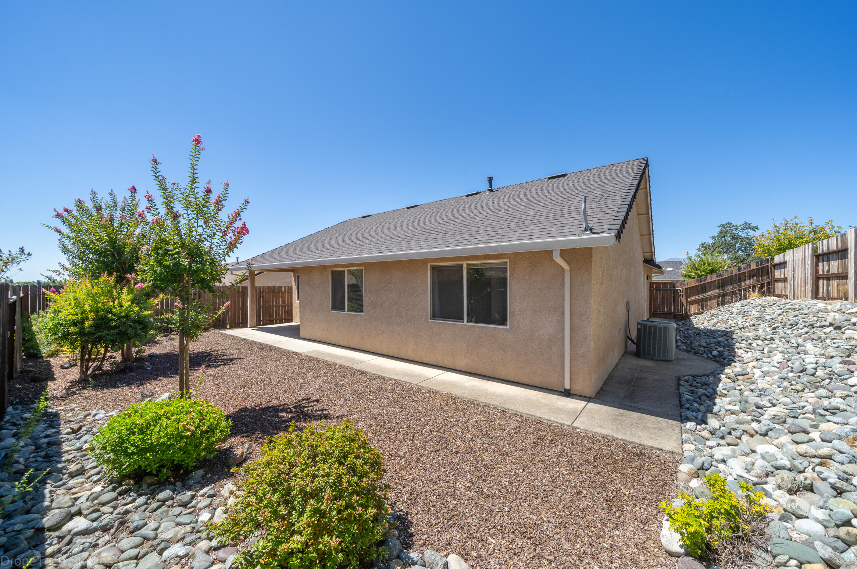 662 Volcano View Trail Redding, CA 96003 - Photo 19 of 26 a house with trees in front of it