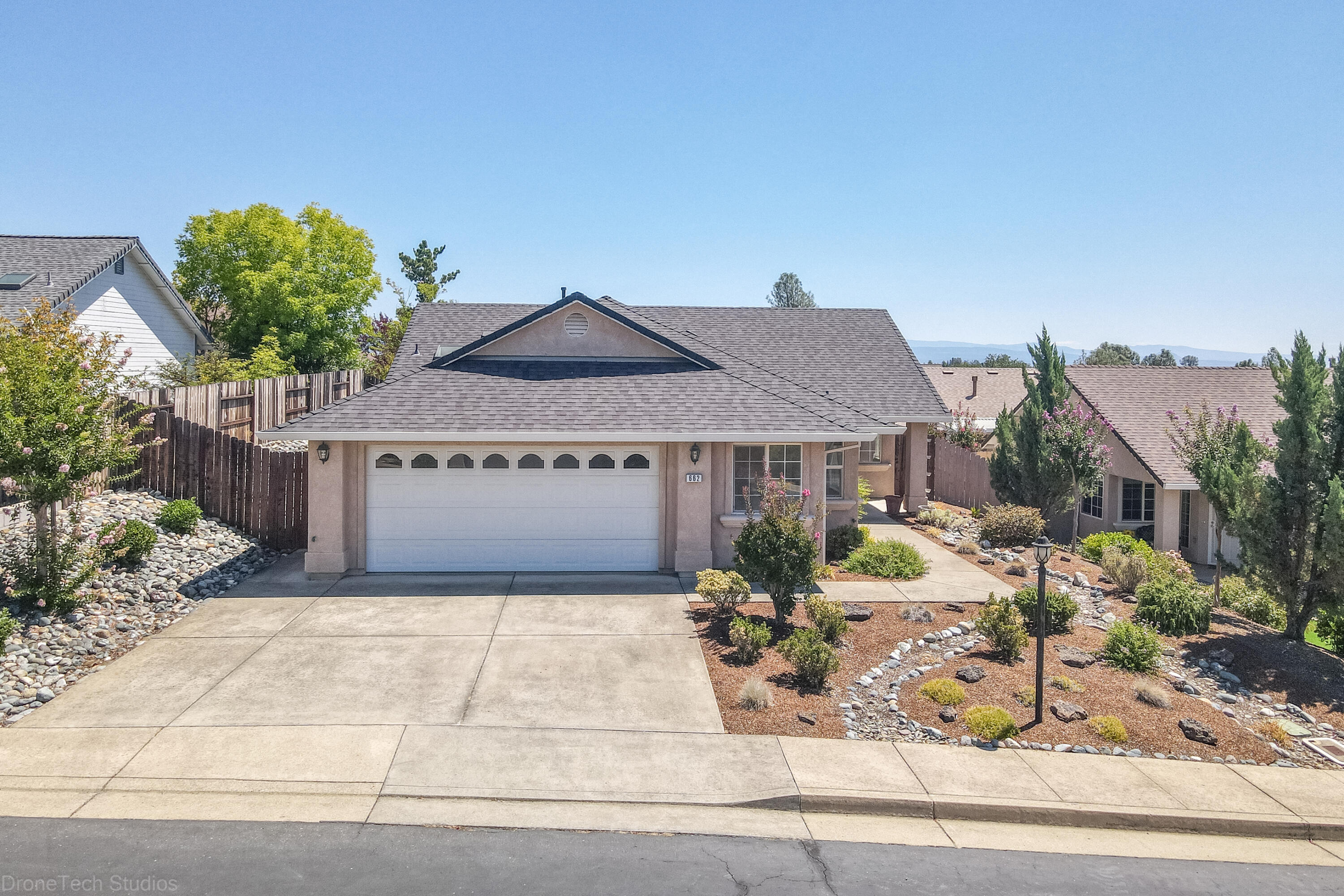 662 Volcano View Trail Redding, CA 96003 - Photo 2 of 26 a front view of a house with garden