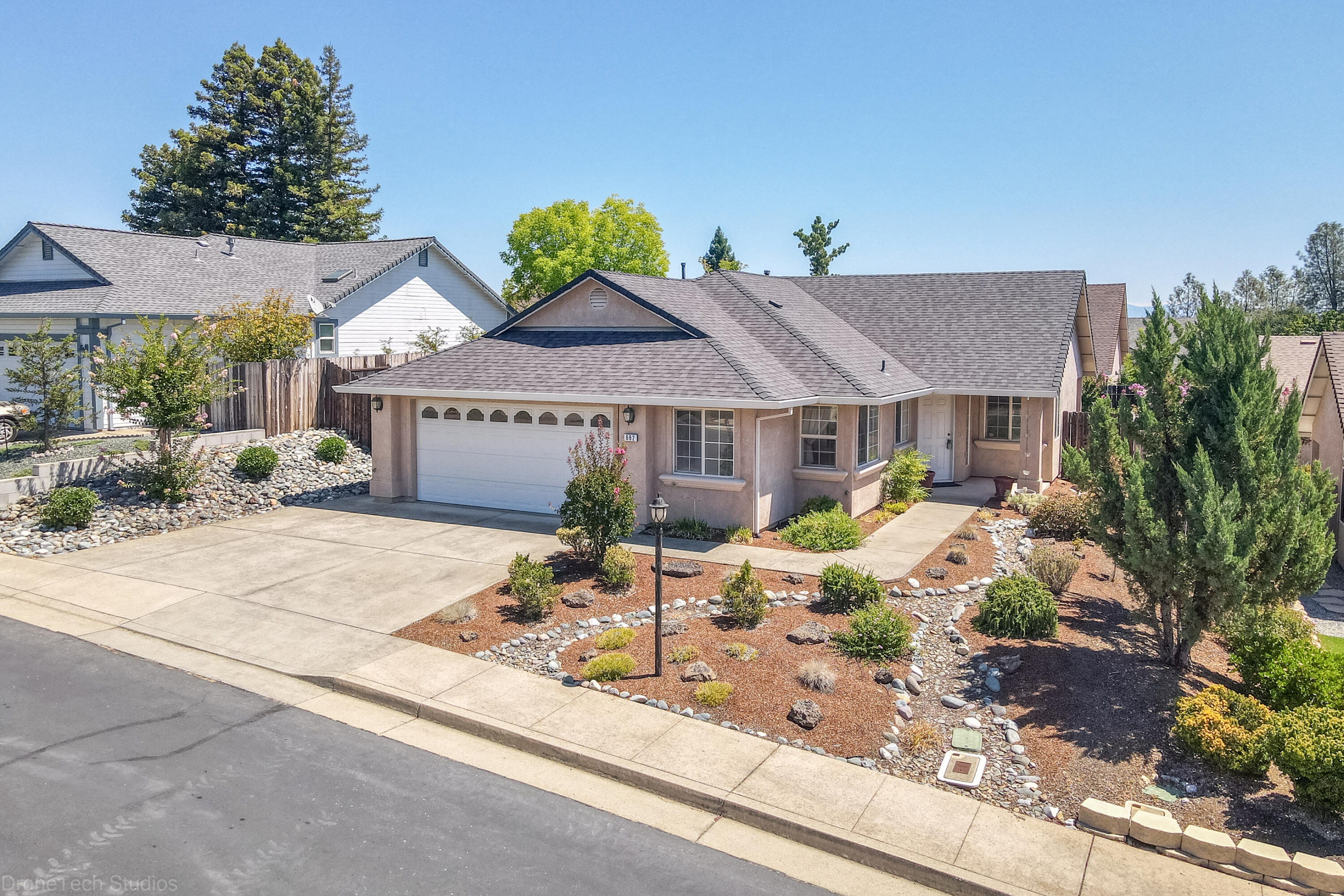 662 Volcano View Trail Redding, CA 96003 - Photo 21 of 26 a front view of a house with garden