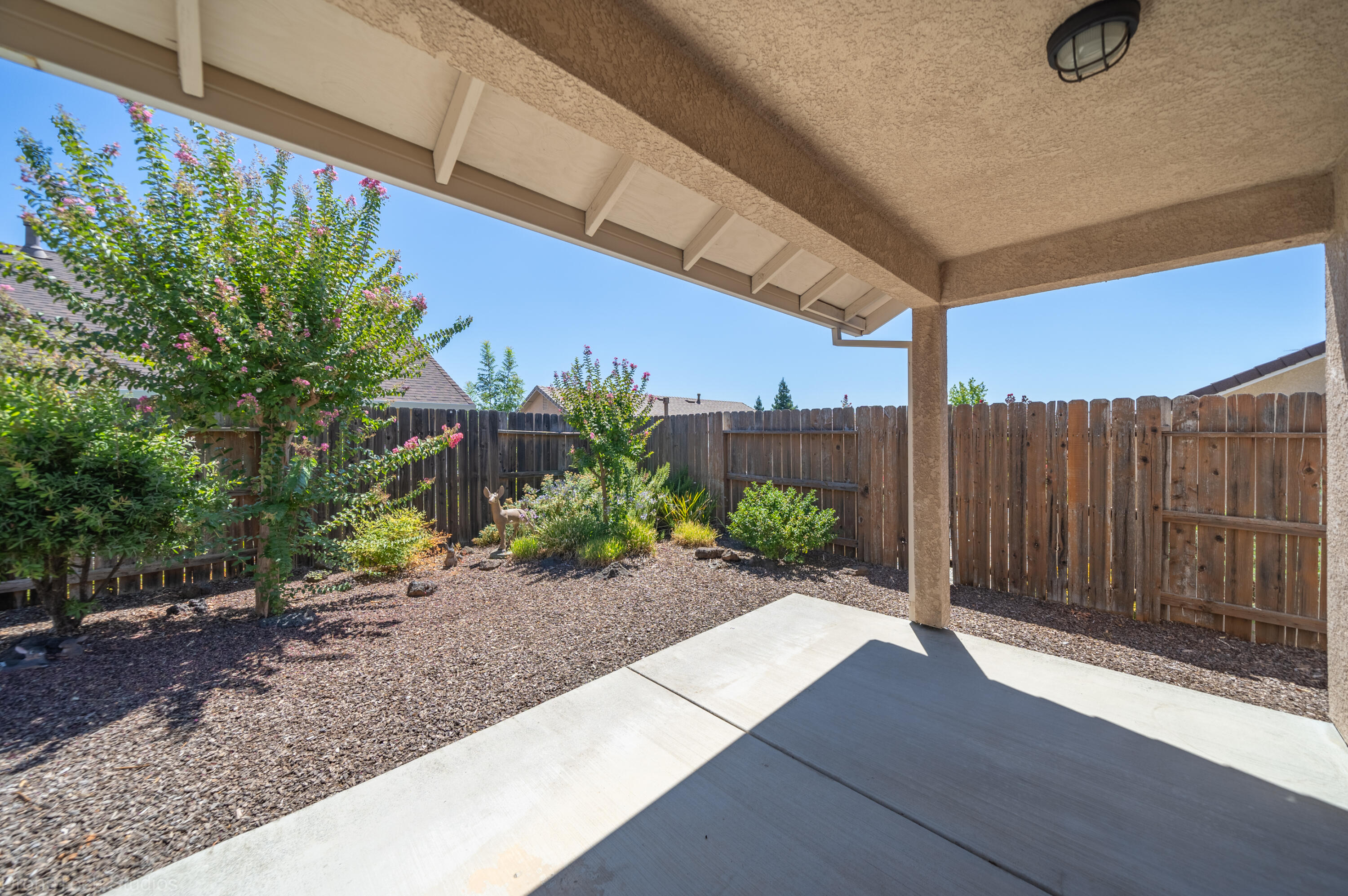 662 Volcano View Trail Redding, CA 96003 - Photo 3 of 26 a view of a backyard