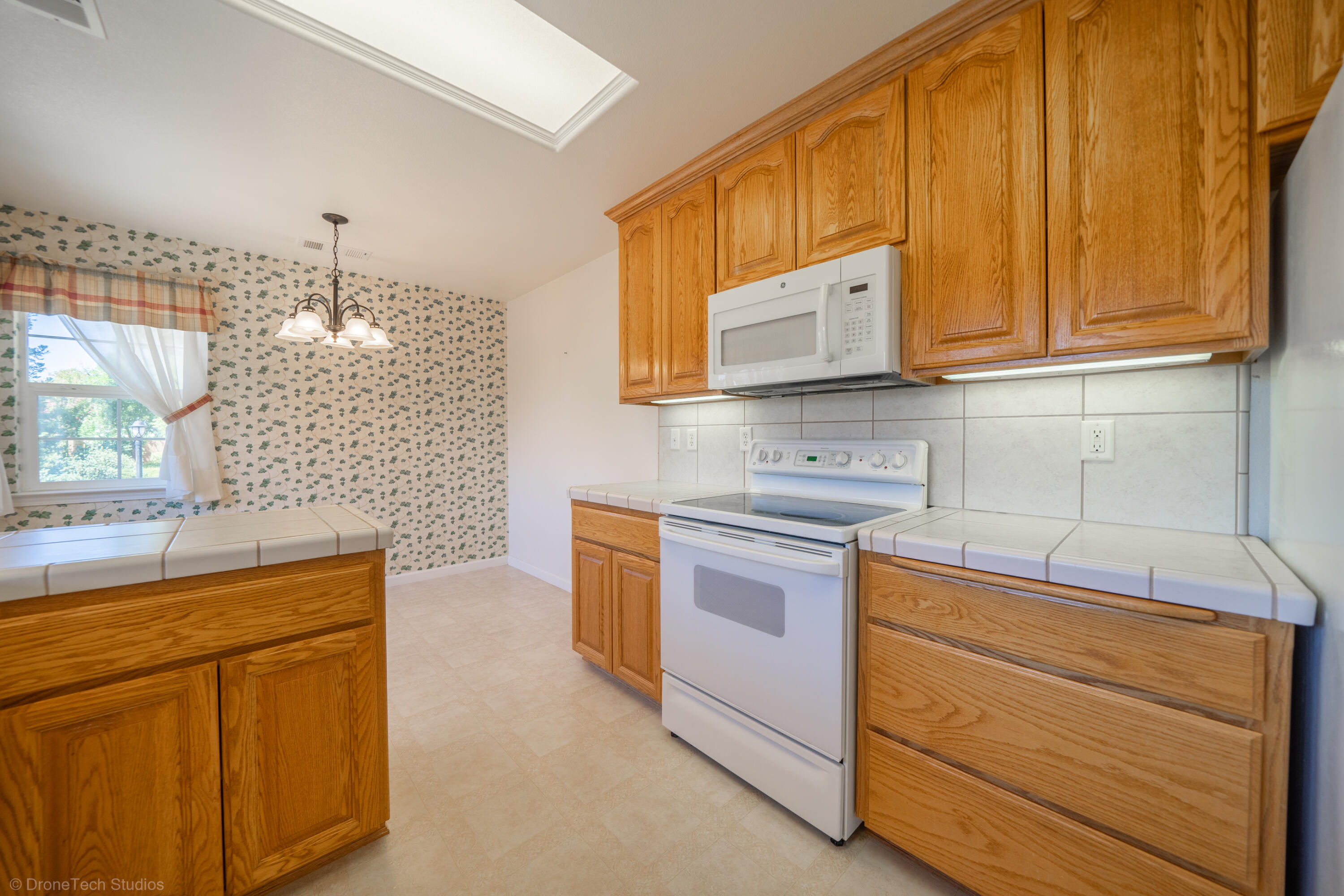 662 Volcano View Trail Redding, CA 96003 - Photo 7 of 26 a kitchen with stainless steel appliances granite countertop a sink stove and cabinets