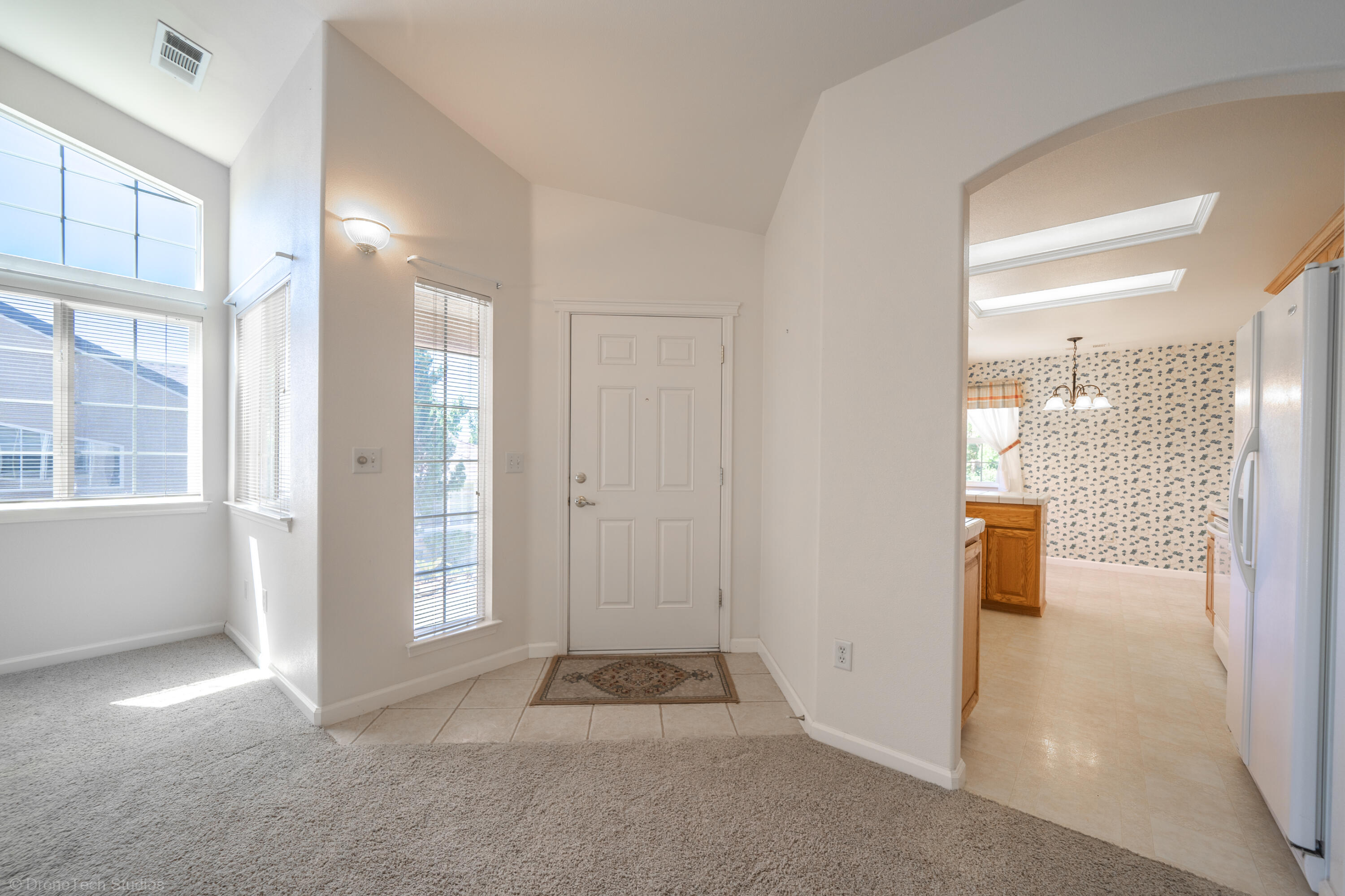 662 Volcano View Trail Redding, CA 96003 - Photo 9 of 26 a view of an empty room and kitchen with a sink