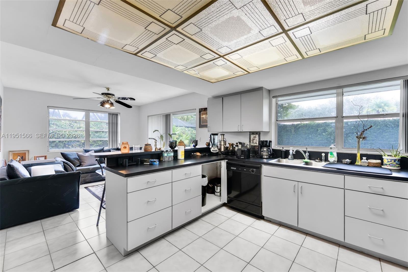 9925 Southwest 97th Place Miami, FL 33176 - Photo 11 of 15 a kitchen with stainless steel appliances granite countertop a sink and cabinets