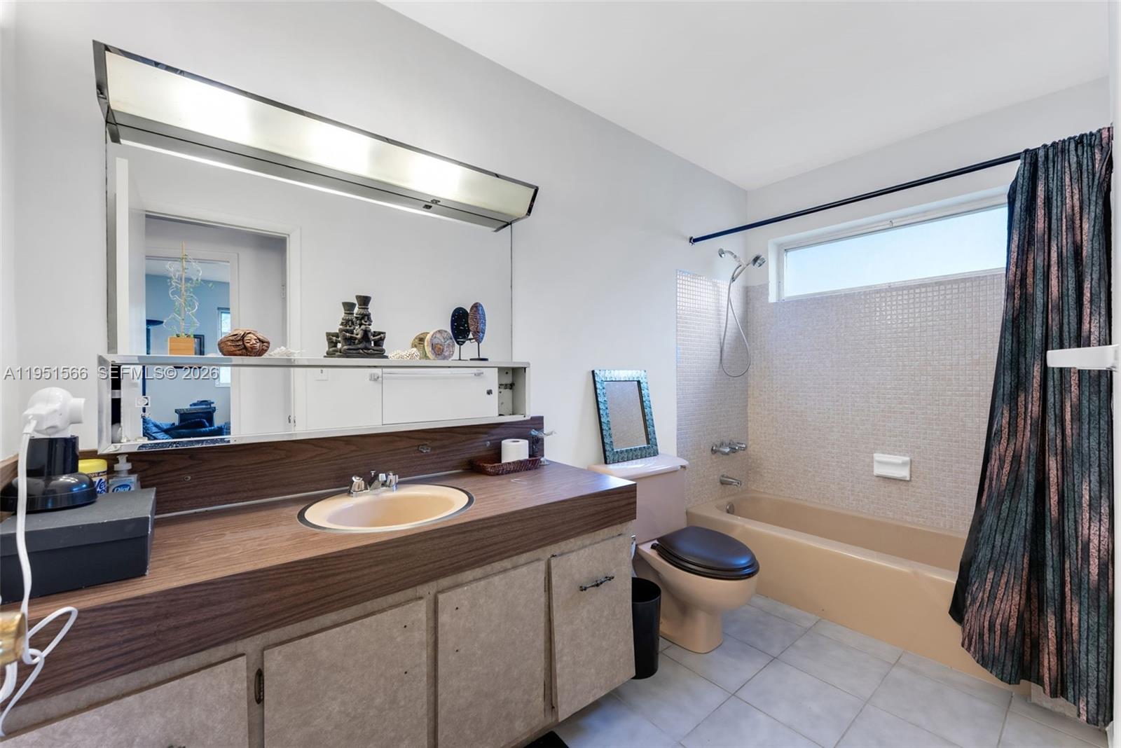 9925 Southwest 97th Place Miami, FL 33176 - Photo 14 of 15 a bathroom with a sink a toilet a mirror and shower