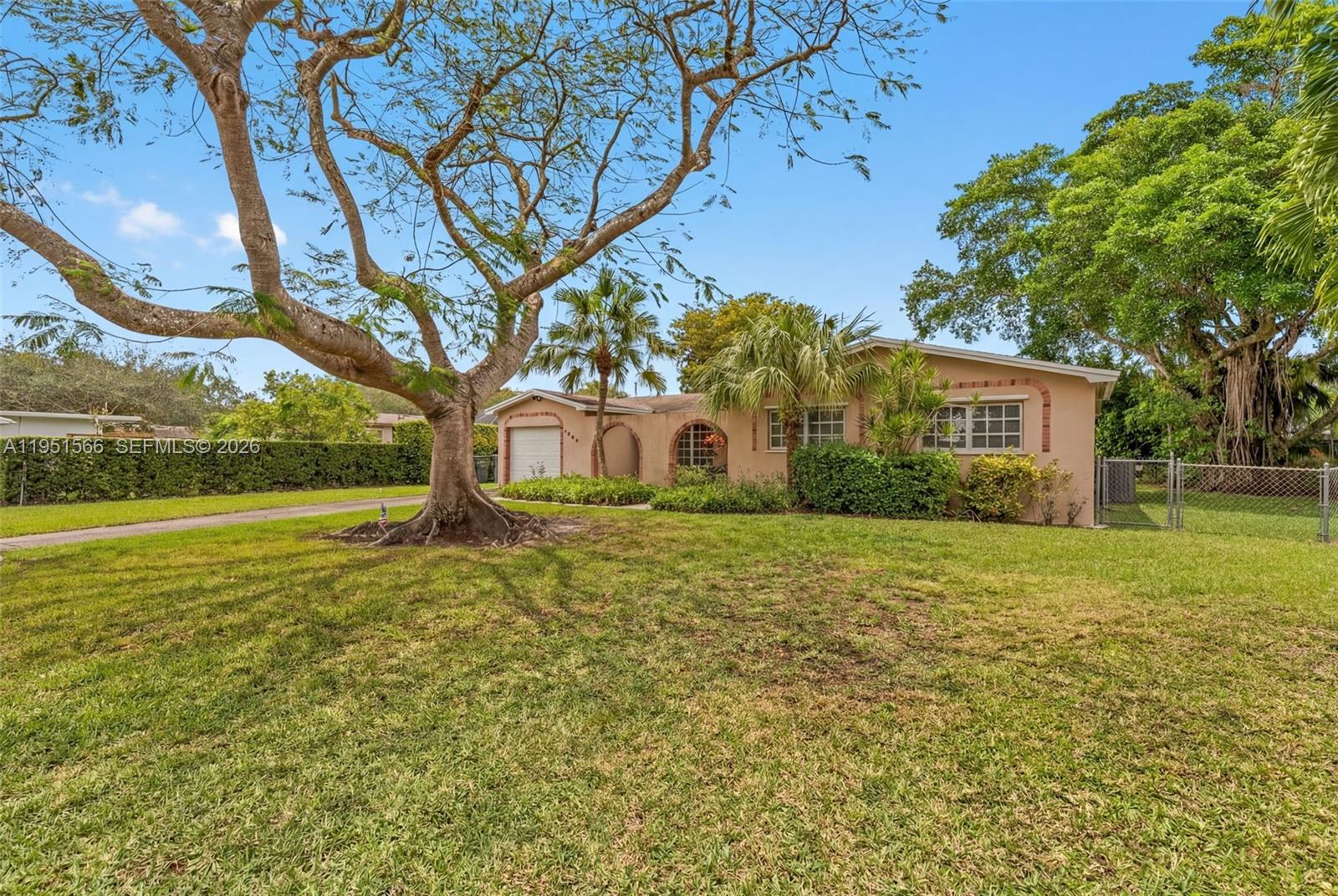 9925 Southwest 97th Place Miami, FL 33176 - Photo 3 of 15 a house view with a garden space