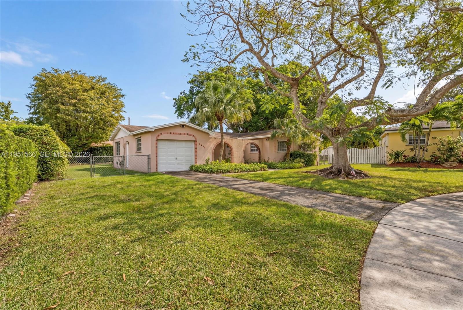 9925 Southwest 97th Place Miami, FL 33176 - Photo 4 of 15 a house view with a garden space