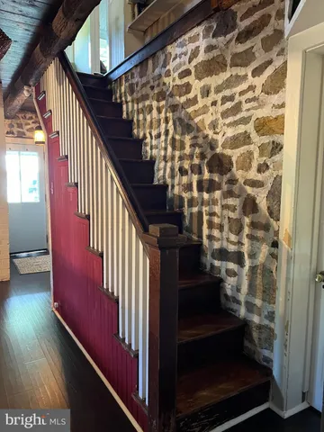 a view of entryway with wooden floor