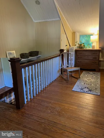 a view of entryway with wooden floor