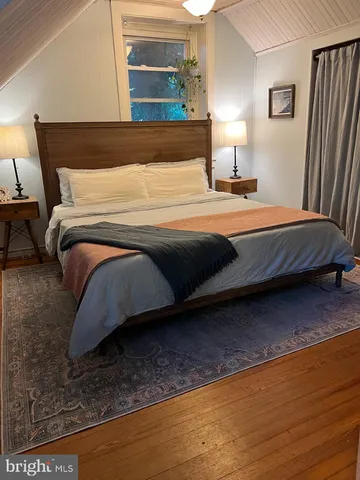 a bedroom with a bed and closet