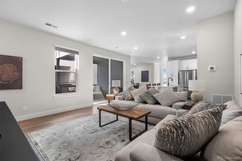 a living room with furniture and a rug