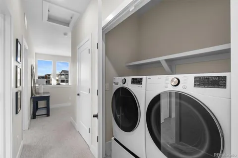 a view of washer and dryer in a utility room