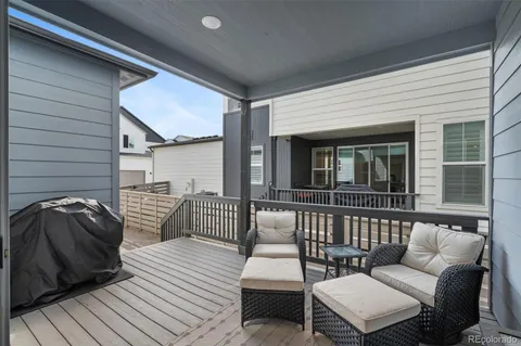 a balcony with furniture and view