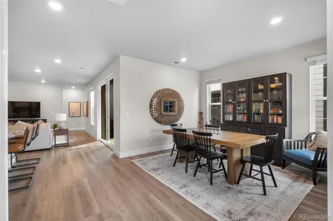 a view of a dining room with furniture window and wooden floor