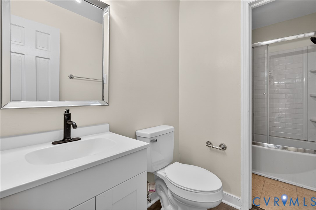 10050 Purcell Road Richmond, VA 23228 - Photo 22 of 26 a bathroom with a sink a toilet and shower