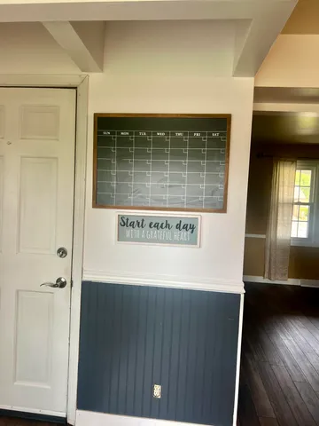 a view of a chairs and table in the balcony