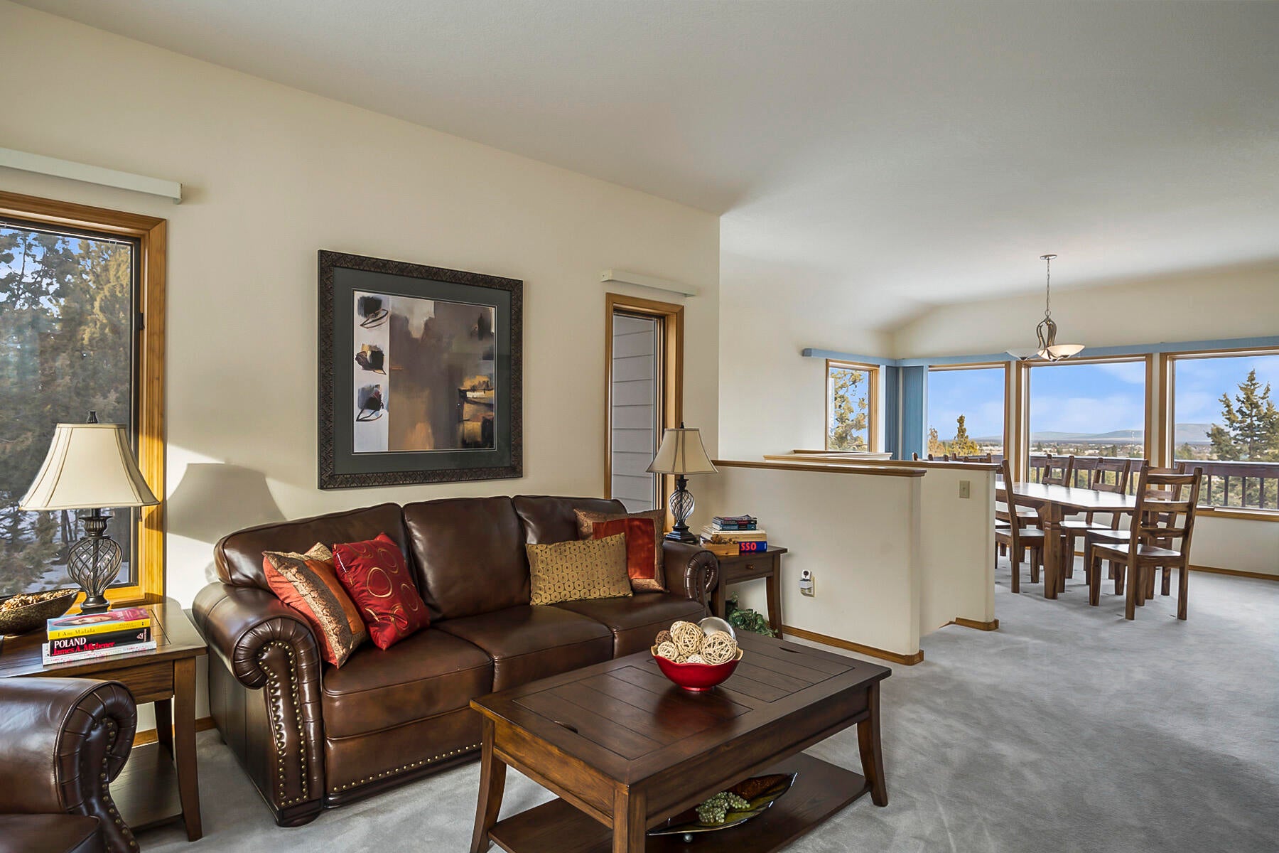 3808 Northwest Summerfield Road Bend, OR 97703 - Photo 5 of 38 Spacious living room leads into the formal dining area with separate entrance into the kitchen. Access the finished basement with private entrance from here as well.