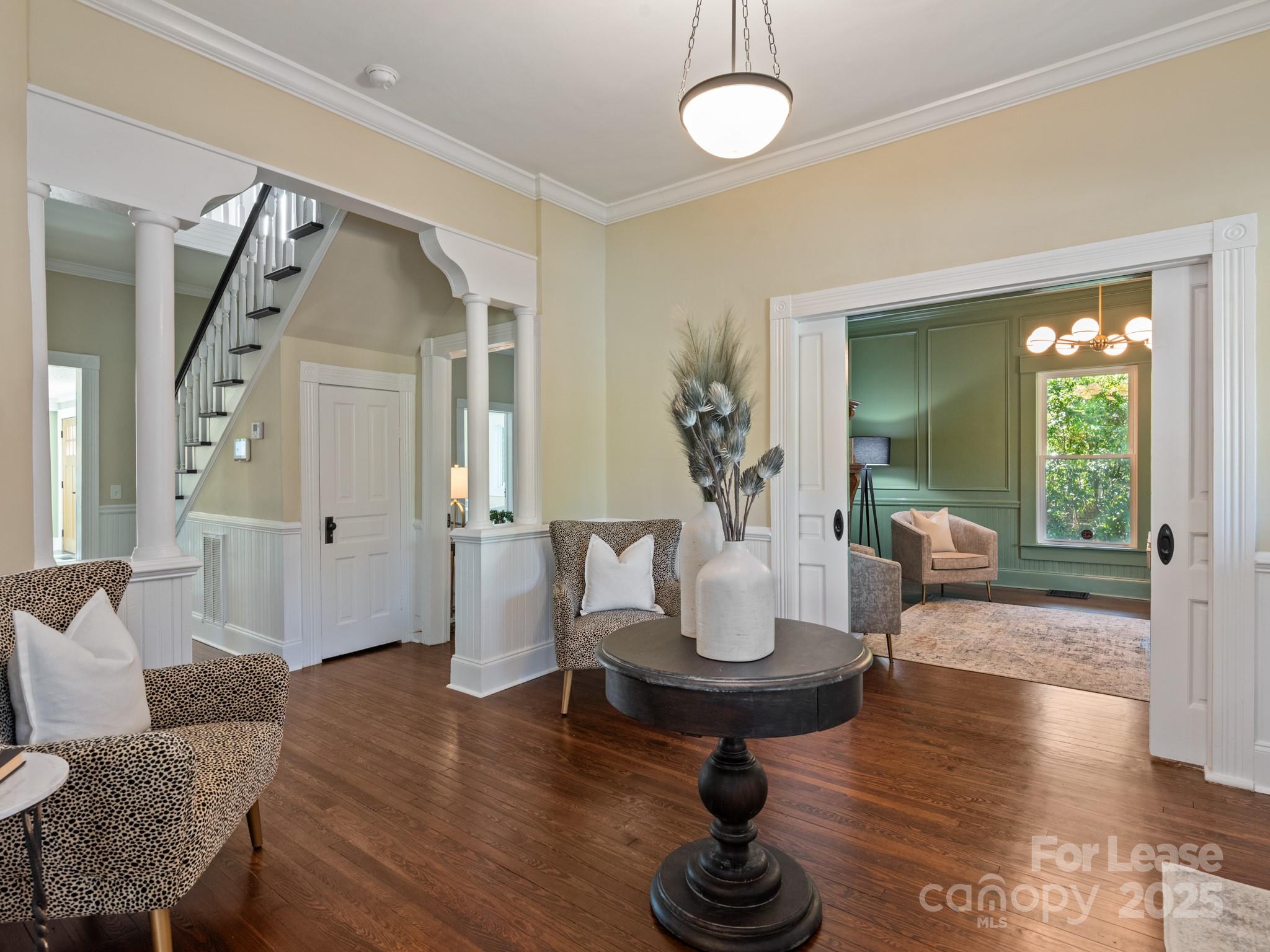 402 South Chester Street Gastonia, NC 28052 - Photo 11 of 48 a living room with furniture and a wooden floor