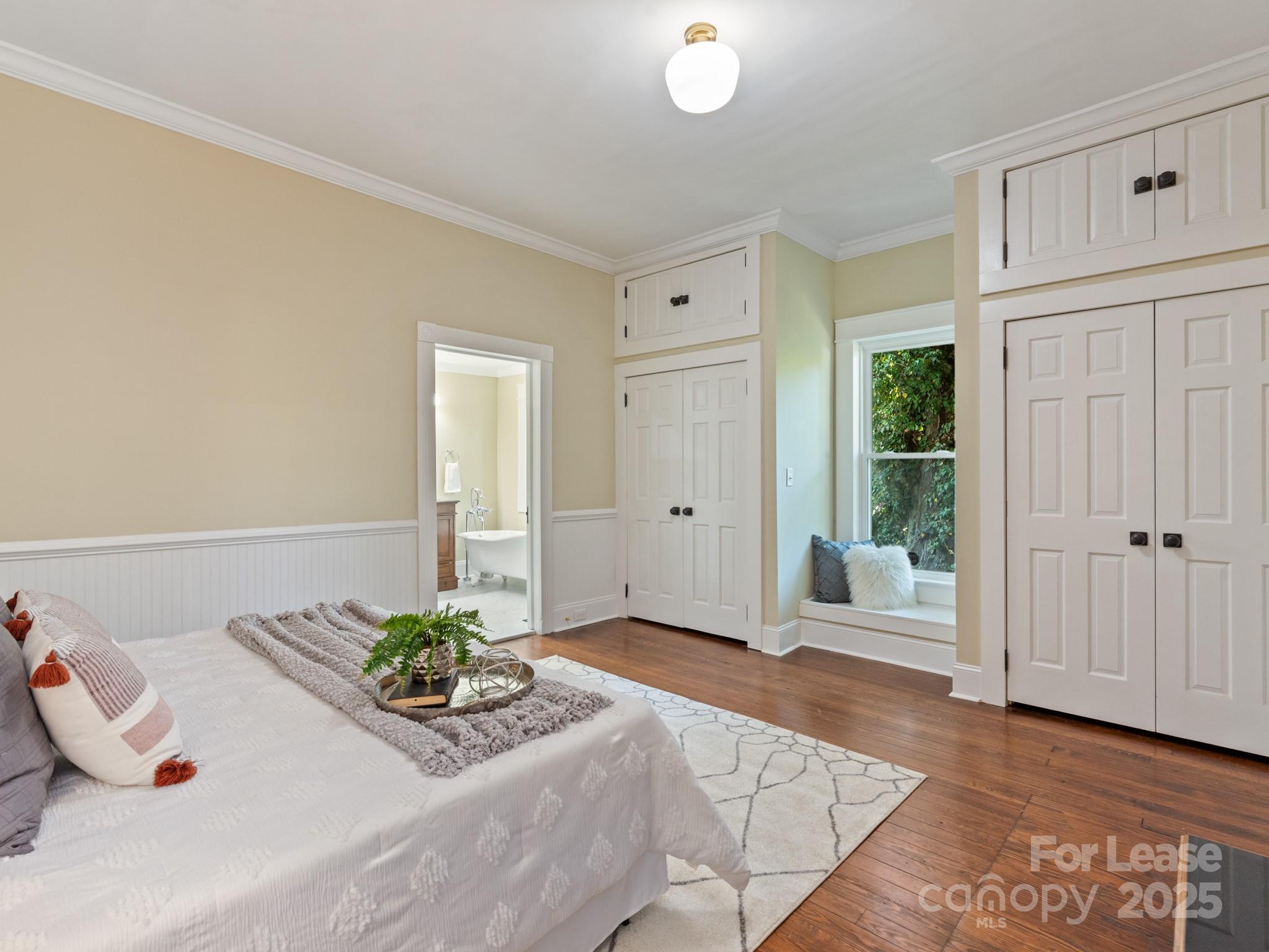 402 South Chester Street Gastonia, NC 28052 - Photo 14 of 48 a bedroom with a bed and a window